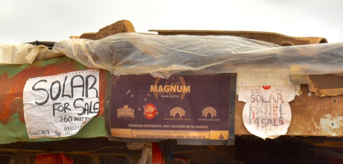 Detail from the storefront showing the solar panels for sale. There is a vibrant after-market for panels, as they often change hands, depending on the capital needs of a family.