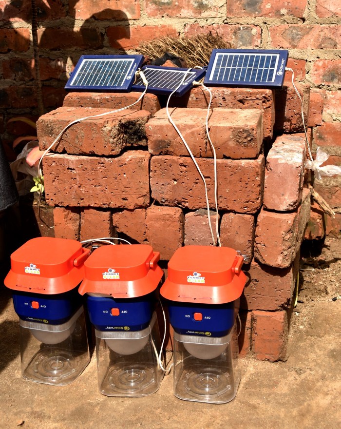 Several modern, portable, solar-powered LED lamps sold at very low cost by mobile provider Econet. The owner rents these lamps out for short-term use.